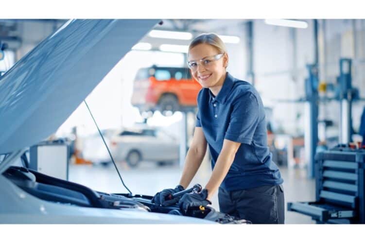 Female Car Mechanic is Posing in a Car Service